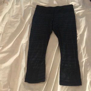 Blue and black Lululemon cropped leggings
